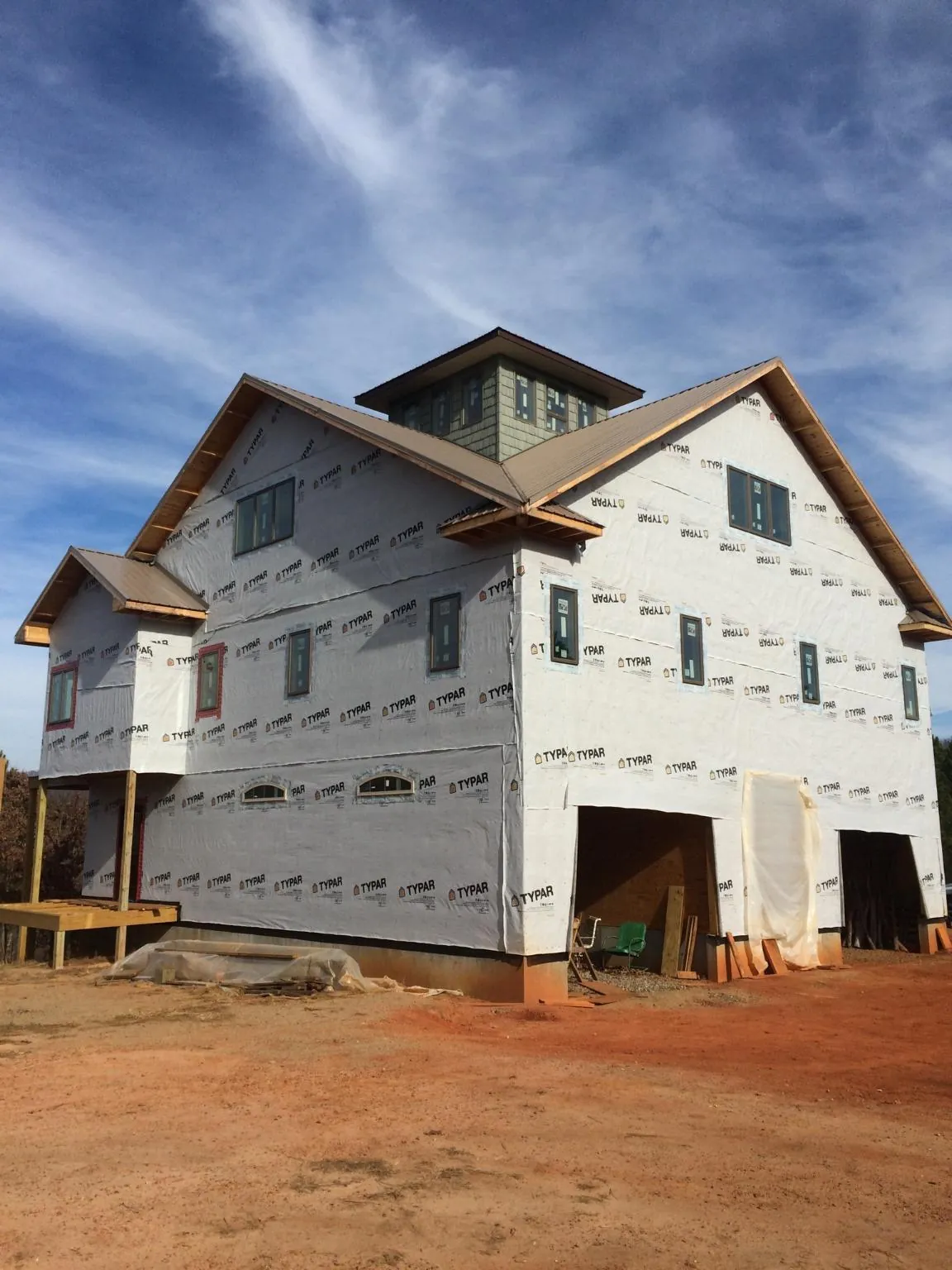 New two story house under construction with a cupola and gabled roofs in Lakeland